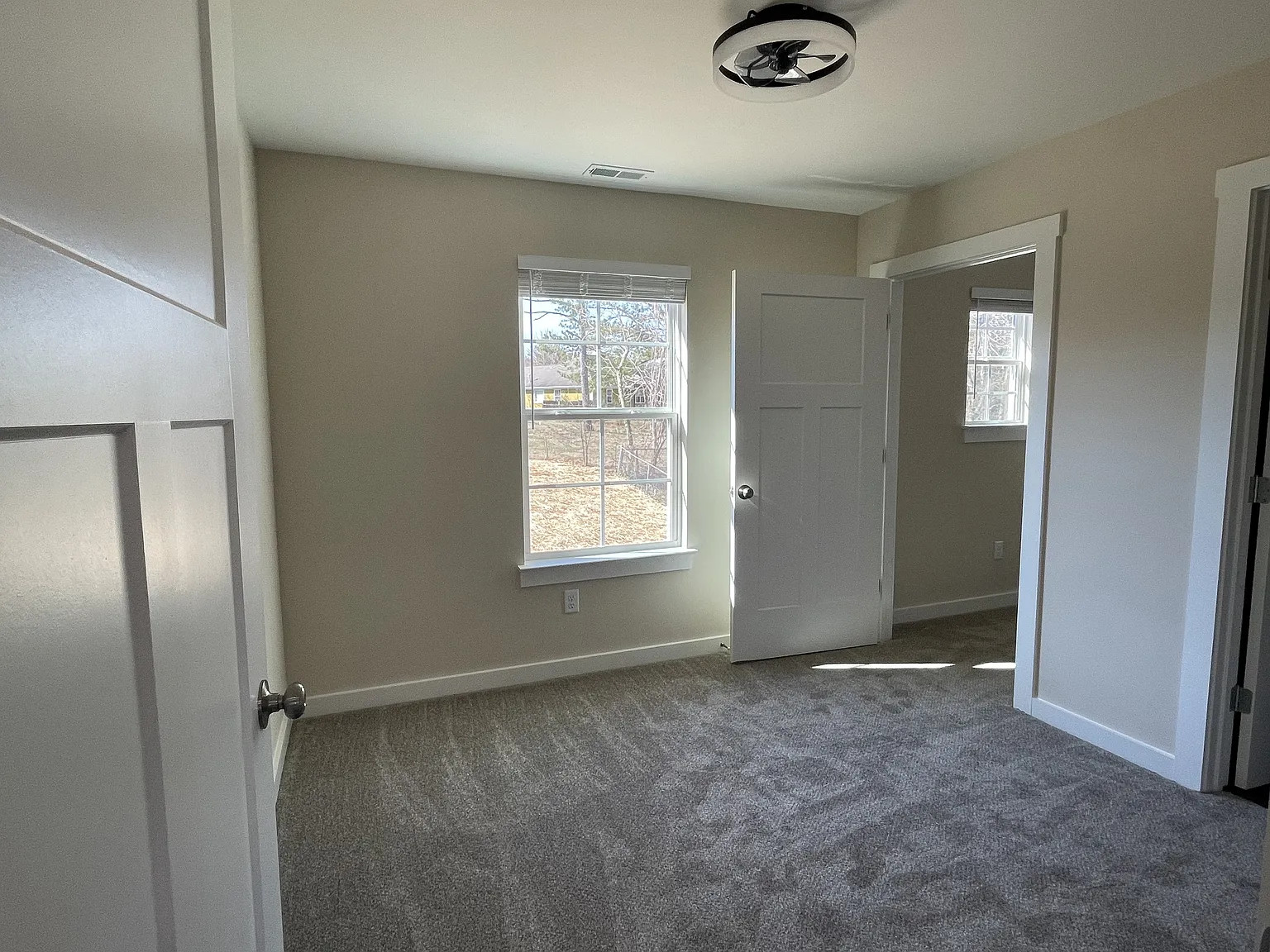 Magnolia duplex bedroom with door — after