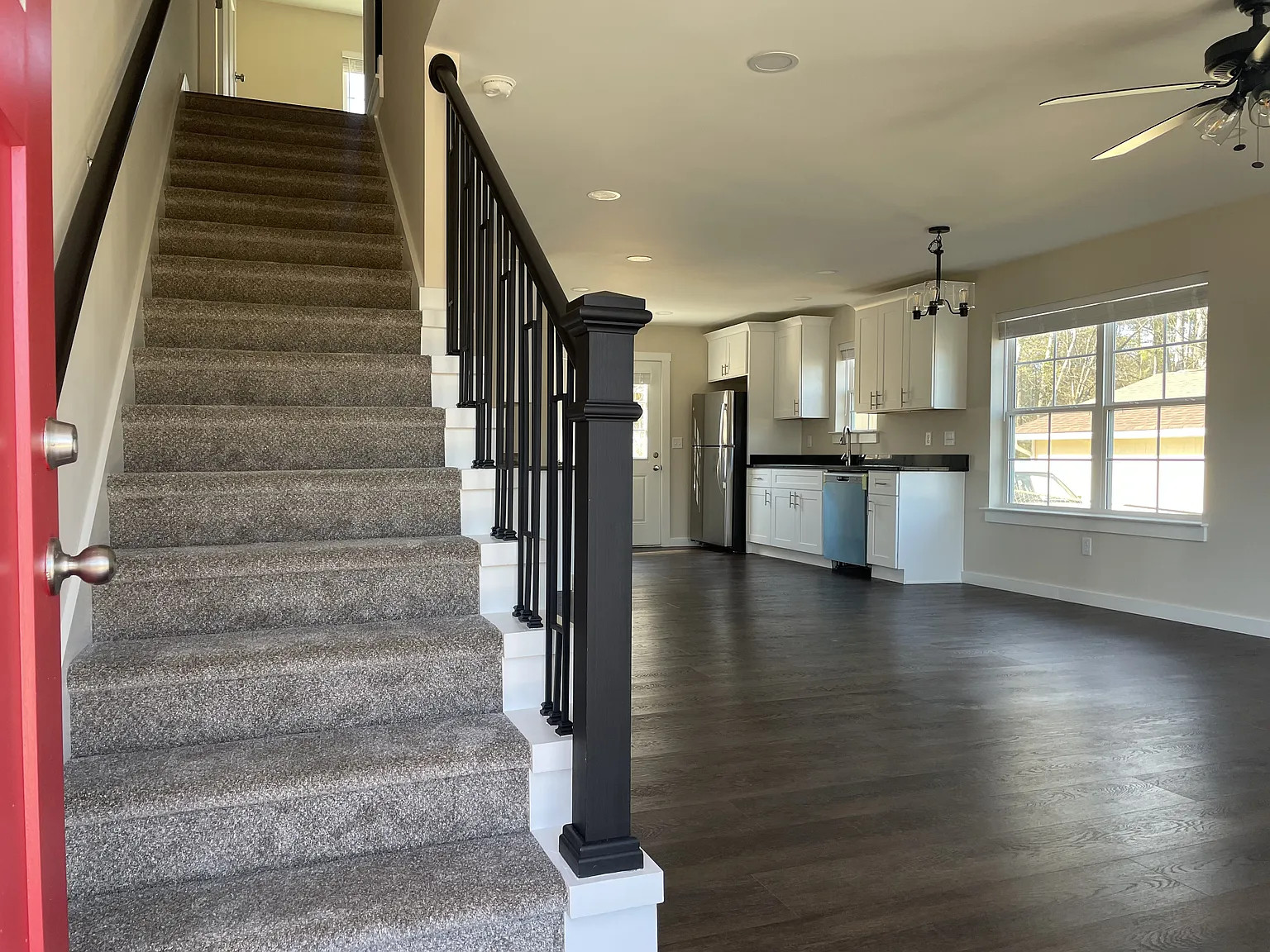 Magnolia duplex entry stairs kitchen — after