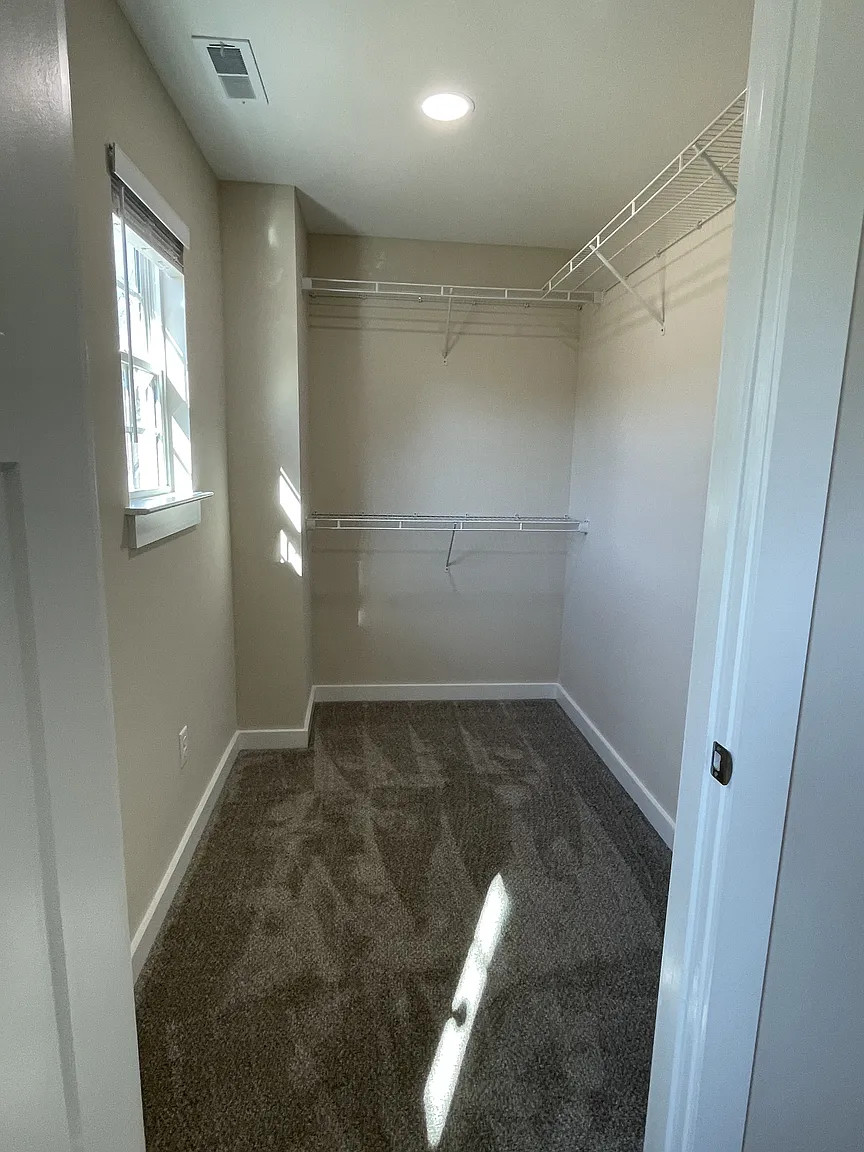 Magnolia duplex walk in closet — after